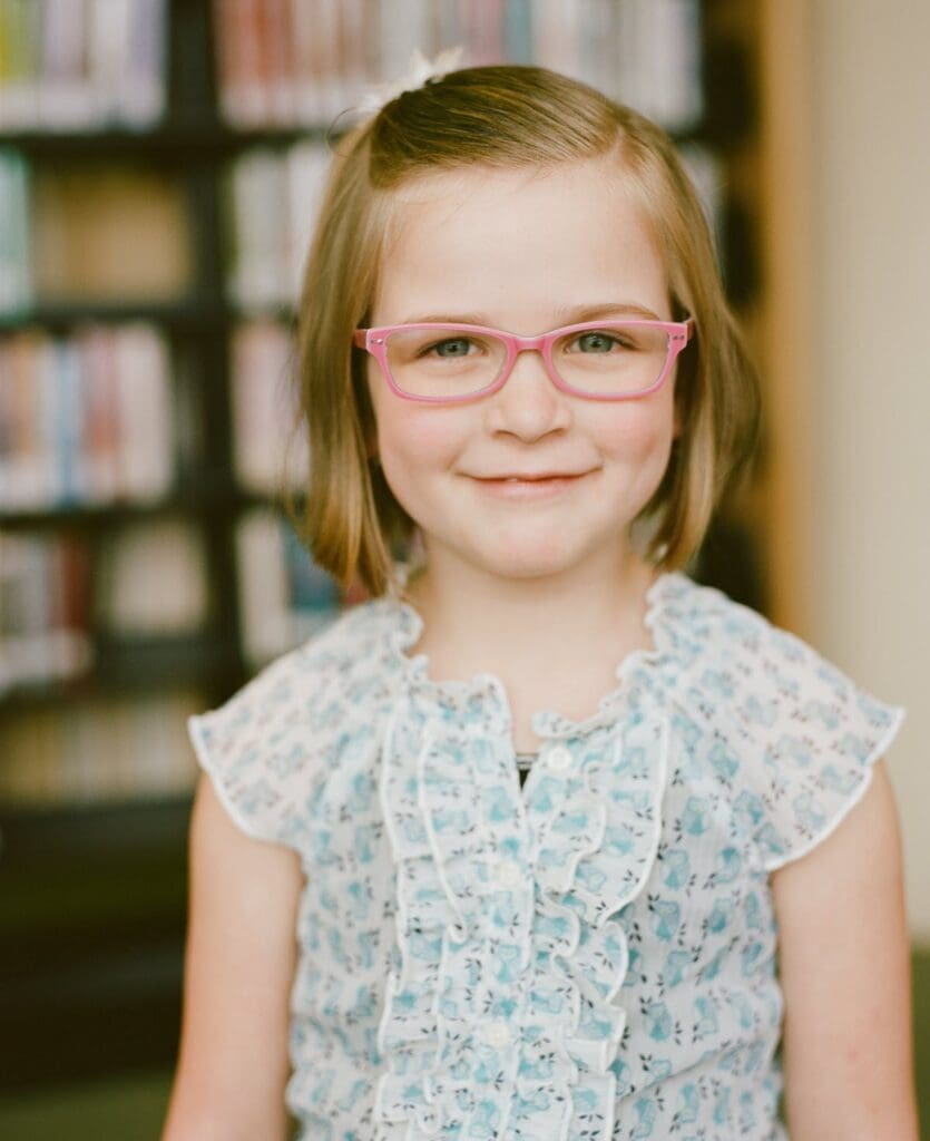 young girl with glasses