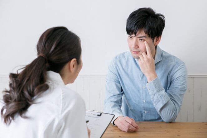 man meeting with eye doctor