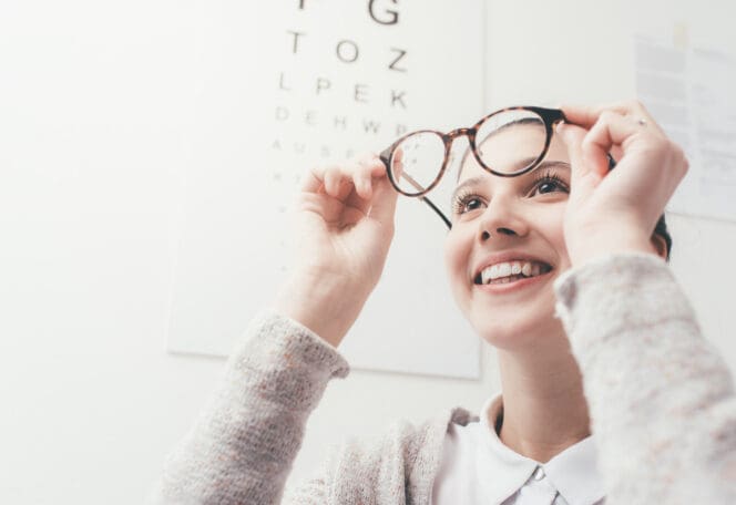 woman with new eye glasses prescription