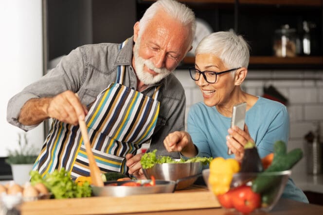 couple cooking and eating healthy