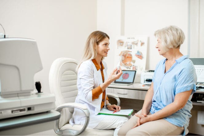 woman talking with eye doctor