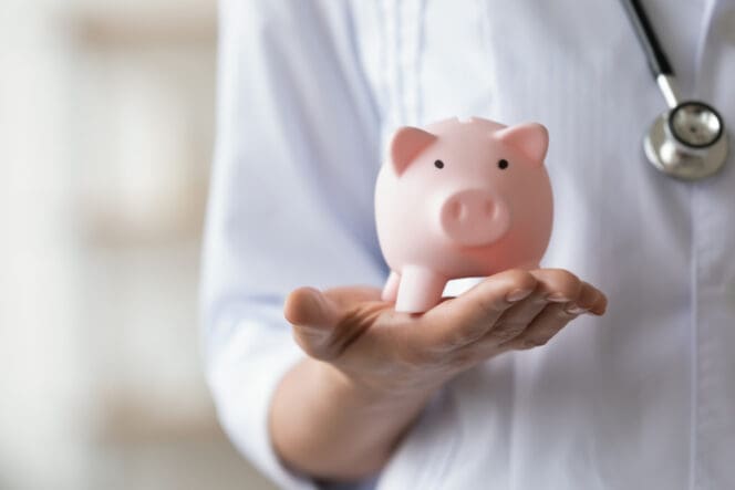 man holding a piggy bank